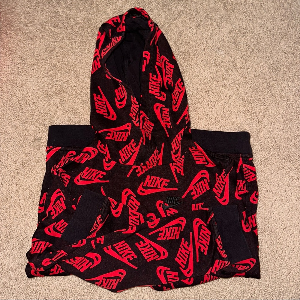 boys red and black nike hoodie.